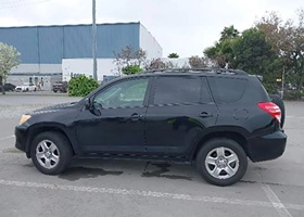 side view of a black 2010 Toyota RAV4